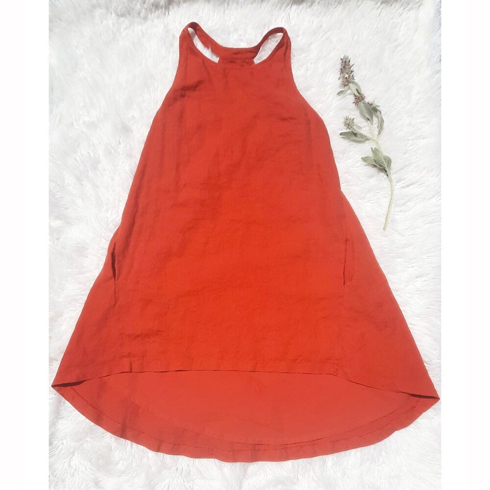 Super fly in this orange mini dress